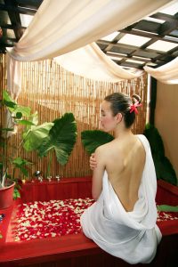 Woman enjoying a spa session at Kenko Wellness